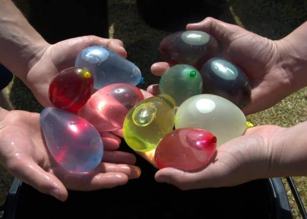 Water balloons on a hot day is one of the most fun ways to keep kids busy. And they'll definitely remember it for years.