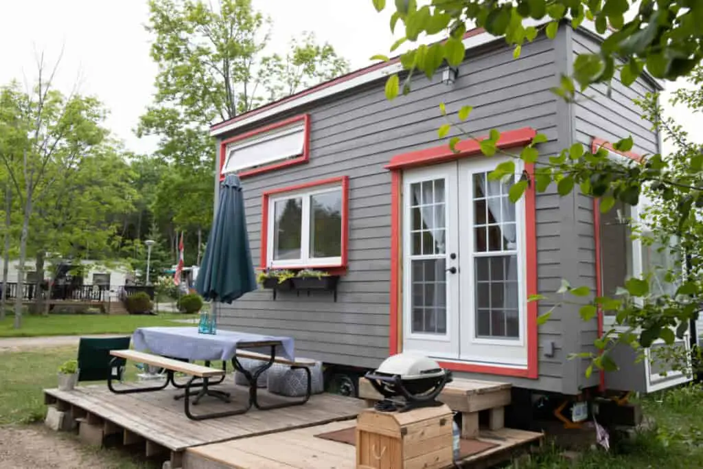 Buying or renting a tiny house is a low-cost living arrangement if you're able to downsize your possessions.